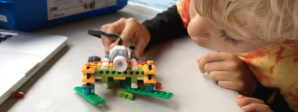 Kids playing with LEGO WeDo robot